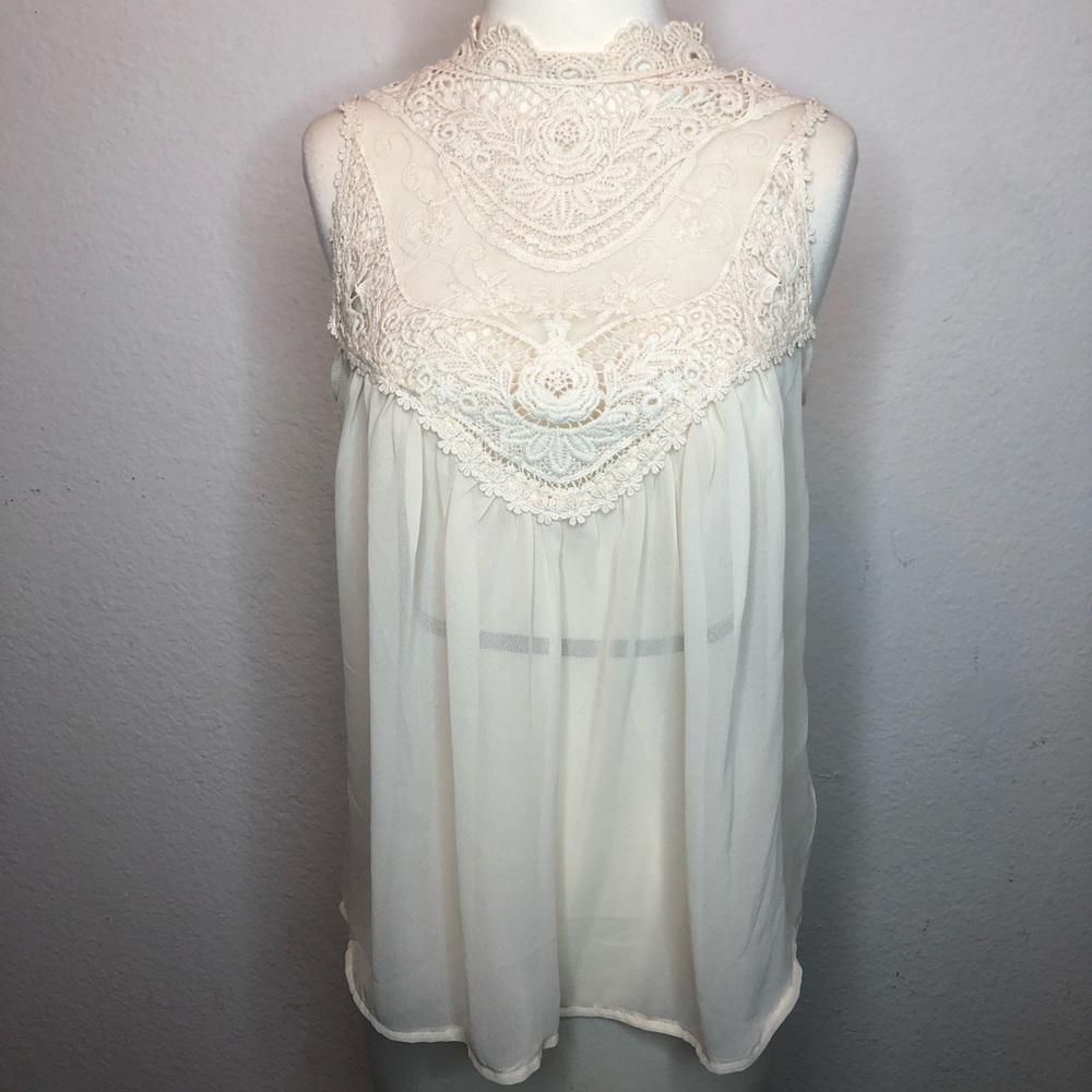 White/cream Lacey sleeveless top sheer